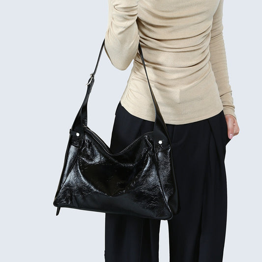 Chic Shine with Modern Edge Glossy Black Hobo Bag